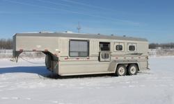 2004 Norberts 3 horse trailer.  Bought brand new in 2005.  6 foot short wall insulated and lined living quarters with queen bed in the nose.  Table and chairs and bench with storage underneath can also be used as a bed.  Extra large RV window.  6'9 wide,