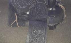 New 12" child's black western saddle, used maybe 5x's, lots of tooling, soft leather, suede seat, good fleece an it has a wood tree. This is not a cheap plastic saddle or an Ebay special, it is a very well made saddle that will last for years
Taking