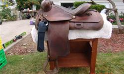 15.5" Western saddle, padded seat, leather covered stirrups, comes with saddle pad