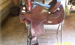 For Sale - Big Horn Western Saddle. 16" seat , 7 1/2" gullet ( 1/2" wider than FQH), ralide tree, padded grain out seat, double drop stainless steel dee's, brown in color, barbed wire tooling, silver concho's; great for broad shouldered, short-backed