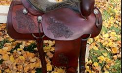 Gorgeous 16" saddle King of Texas saddle. Fits wide horses. It is about 20 years old. In excellent condition, very well cared for, has always been kept indoors. Well made quality saddle. Has rawhide stirrups, good fleece, solid horn & tree. Can be used