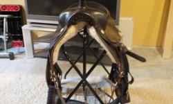 Saddle is in good shape, comes with breast plate and cinch.
