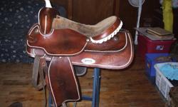 FOR SALE 17 INCH WESTERN SADDLE WITH SEMI QUARTER HORSE BARS . SADDLE IS FOR SALE BECAUSE IT DOES NOT FIT OUR DAUGHTERS NEW HORSE