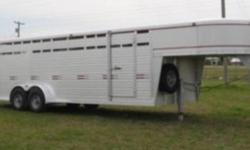 24'x6'9" Dura Line with torsion 7000 axles, 1/2 slide on center,solid gate up front, slide/swing rear door,front escape door, gate across nose,treated pine floor, (mats available),1"x3"sideribs with 14 gauge side panel,slam latches on all gates with