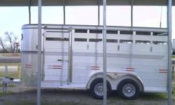 2012 6x16x6'6" H   Aluminum Stock/horse trailer with 2-  5200 axles with electric brakes and 10 ply tires.
Rear door swing with half slide, center divide gate ,front exit door.
Diamond checker plate floor over 4" I beams for a Tough floor!
Diamond checker