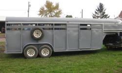I have a 1993 Circle Z, steel Combination 4 Horse Slant Trailer with dressing room. It is a gooseneck trailer very strong well built. It has a rear slider door that is also a full swing door. With this it can be backed right against the barn for loading