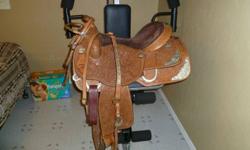 Would make a great Christmas gift -16 inch FQHB Stallion Tack Intl custom made Show saddle with matching bridle and breast plate lots of silver and always stored inside Very comfortable saddle