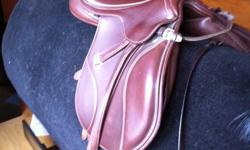 Bates Brown Leather English Jumping Saddle with an adjustable tree. Very comfortable, excellent quality saddle. Gently used. Excellent condition. Comes with stirrups and leathers and girth to fit a 15-16 hand horse. Seat is a 17 inch.