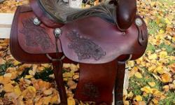~Coming to Kelowna and can deliver~
To view or would like to try it out, please call 250-803-1663.
 
 
Gorgeous 16" Saddle King of Texas. About 20 years old. In excellent condition. Nicley tooled with rawhide stirrups, good fleece, solid horn & tree. Very
