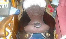 Beautiful western saddle for sale. Fits most horses.
 
17" dark oil king series trail saddle with endurance stirrups.
gently used for one season. I need a saddle that has a smaller seat. I am willing to trade for a synthetic western with a 16" seat. not