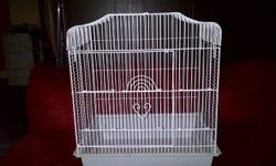 Dimensions are 18" wide by 14" long by 21" high. Clean and in good condition. Comes with a food and water dish, 2 perches and some toys. Perfect for a budgie or small size bird like that. Cage has a slide out tray for easy cleaning. Has a small size door
