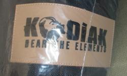 Brand new...never even been out of the bag!
 
Kodiak heavy duty winter turn-out blanket.  1200 Denier outer layer with 300 gm fill.  Black with silver piping.  Size 75".