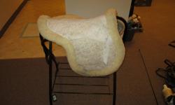 Bought for 200 on sale. It is a saddle pad that has a built in sheep skin half pad. The trim around the pad is sheep skin as well.
