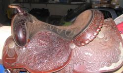 silver on it very nice saddle, I do not ride western any more and need to sell, selling for 1/2 price******
Size 17"
excellent shape
 
And a leather halter m-l size with sheep skin cover*** never used***
$50.00
Ian Miller crosby  eng. saddle 16" very nice