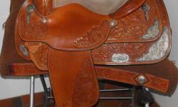 15" Suede seat   MEDIUM OIL Tooled with silver    Measured as FULL QUARTER HORSE BARS(7")
measurements are total length  28",swell 3",horn 3",fenders 22"  Bell stirrups 7" X 6" w
 
Comes with: BIG D Saddle Cover,Matching Headstall(one ear) ,reins and