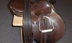 15" Oster youth english saddle c/w stirrups, leathers, 43" girth and 6 3/4 youth riding hat. great shape. $150.00.