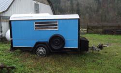 Single axle with spare tire. Drop down loading ramp, with louvered glass back, side and front. metal storage box on front. Light weight utility trailer style body. Has three removeable dividers. No Trades Please.