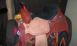 For Sale:  a new Reinsman X-Series, beautiful leather western saddle, 6.75" gullet, full QH bars, silver metal stirrups.  It has a 14.5 inch seat, suitable for youth or lady.   This saddle was on a horse to try out, but is new.  It is a russet color