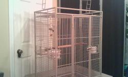 I have a huge parrot cage for sale. Its tan in colour ,play area up top and 2 shelf's that slides out for ease cleaning ,it's solid galvinized coating and 4 big ceramic bowls,that you insert from the outside of the cage and close the  doors. The cage is