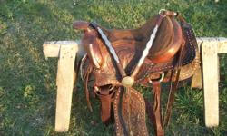 This saddle is about a 15 - 16 inch seat (see pics). The color is a nice burgundy. It has been used on quarter horses and fit well. Would not fit a high withered horse. It has a stain on the seat but dosen't show when riding. Comes with matching