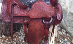 Beautiful 15.5" Red Ranger saddle. All leather, fully tooled. About 40 yrs old, in excellent condition with no marks or scratches. Very well looked after. Has 7.5" gullet, solid horn & tree. Well made saddle. Has #918 on back. All original except fleece