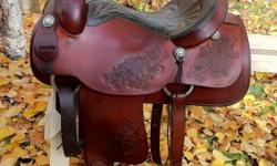 Beautiful 16" saddle King of Texas roper saddle. Fits wide horses. It is about 20 years old. In excellent condition, very well cared for, has always been kept indoors. Well made quality saddle. Has rawhide stirrups, good fleece, solid horn & tree. Can be