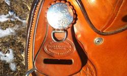 Vern Sapergia model by Willow Creek Saddlery, Nanton, AB. Full QH bars, law assoc 2" box horn, small round skirt, free swing fenders, 3-way rig, 3"flair billets, clip dees for strings, chocolate rough out seat, six silver conchos, excellent condition,