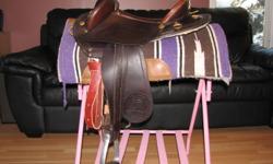 Cleaning out the tack room:
One 16" Rider's Choice Lite Wade saddle.  Lighter weight than an average wade saddle, with regular QH bars.  Slick seat, 5" cantle, basket stamped light leather.  Excellent condition.  $600
Also a Barkley Aussie Half breed