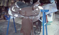 comes complete with matching headstall, reins and breast collar.... new condition, lots of bling