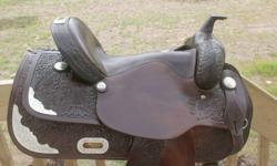 16" FQHB western show saddle for sale in excellent condition. Includes new dark oil bridle and new silver stirrups