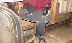 For Sale 16" black Wintec western saddle.  FQB. The saddle is new and has only been on a horse a few times, it is too big for my horse.  $300.00 firm or trade for a saddle with Semi QH bars of same value.