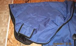 Weather Beeta turnout winter blanket, size 84", with detached hood, tail flap and shoulder gussets. Just been tried on a horse. These blankets retail for $200.00. Asking $135.00 firm